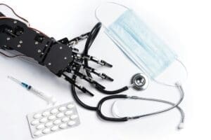 Real robotic hand with medical equipment and drugs.