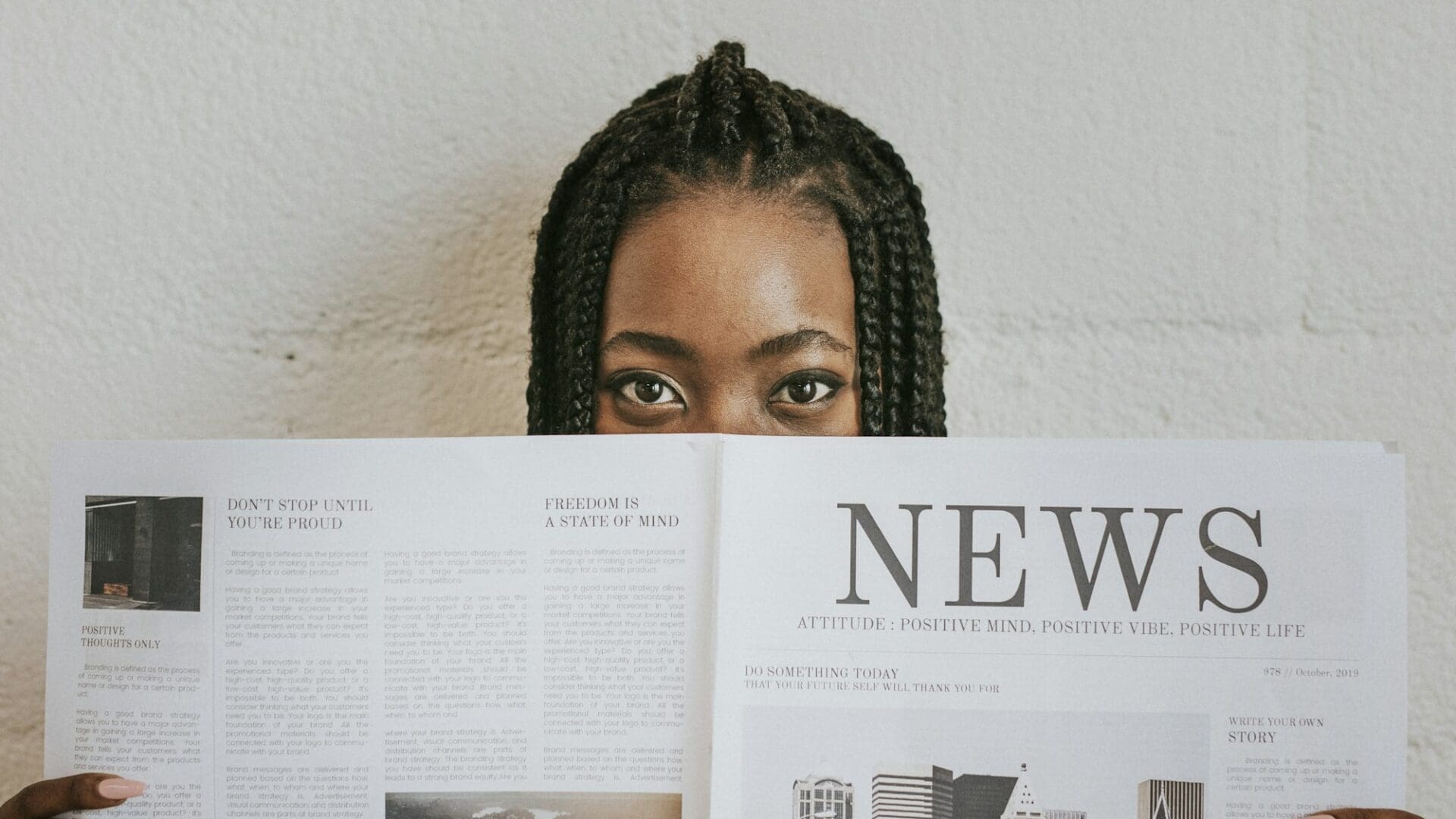 Woman reading newspaper